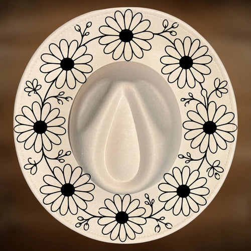 A circle of daisy designs on a wide brim hat.
