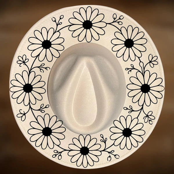 A circle of daisy designs on a wide brim hat.