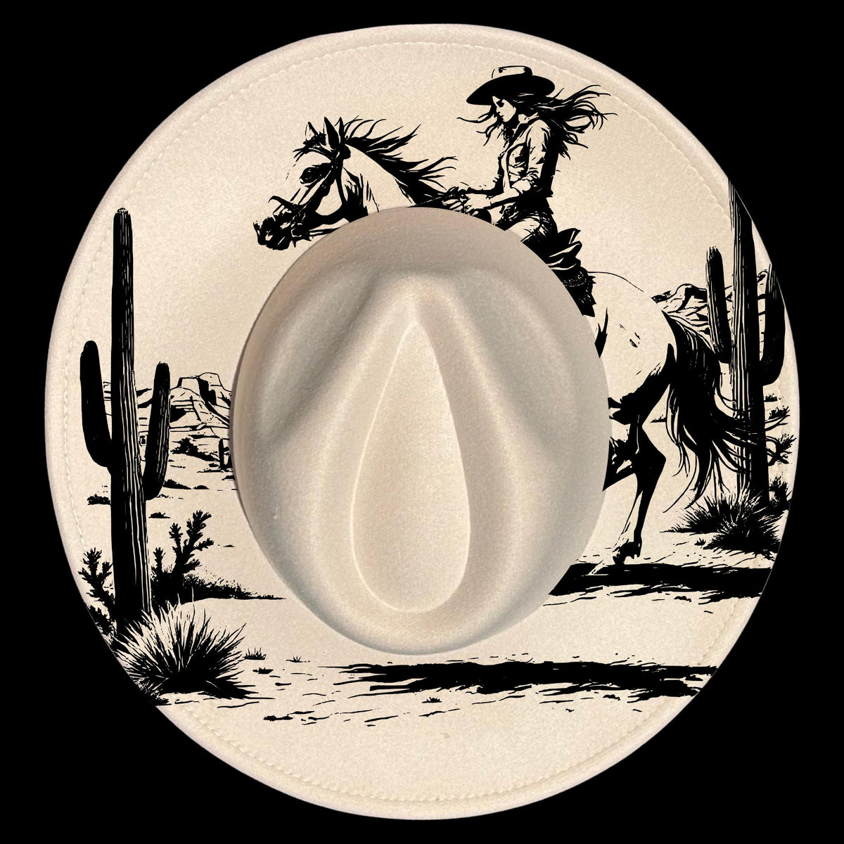 Hat with a cowboy and horse design on a desert landscape.