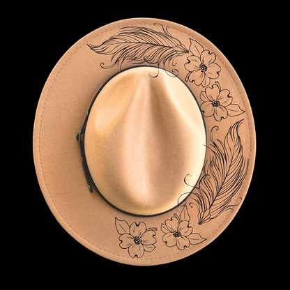 Narrow brim hat with dogwood and feathers floral and feather designs on a black background