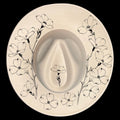 Wide brim hat with floral pattern on a black background