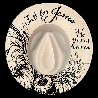 Circular design on a wide brim hat with 'Fall for Jesus' text, pumpkins, and leaves on a black background