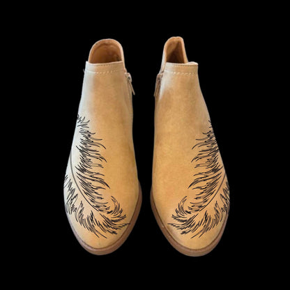 Feather boot burning design on a pair of shoes front view