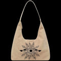 Beige tote bag with a black feathered fan design on a black background