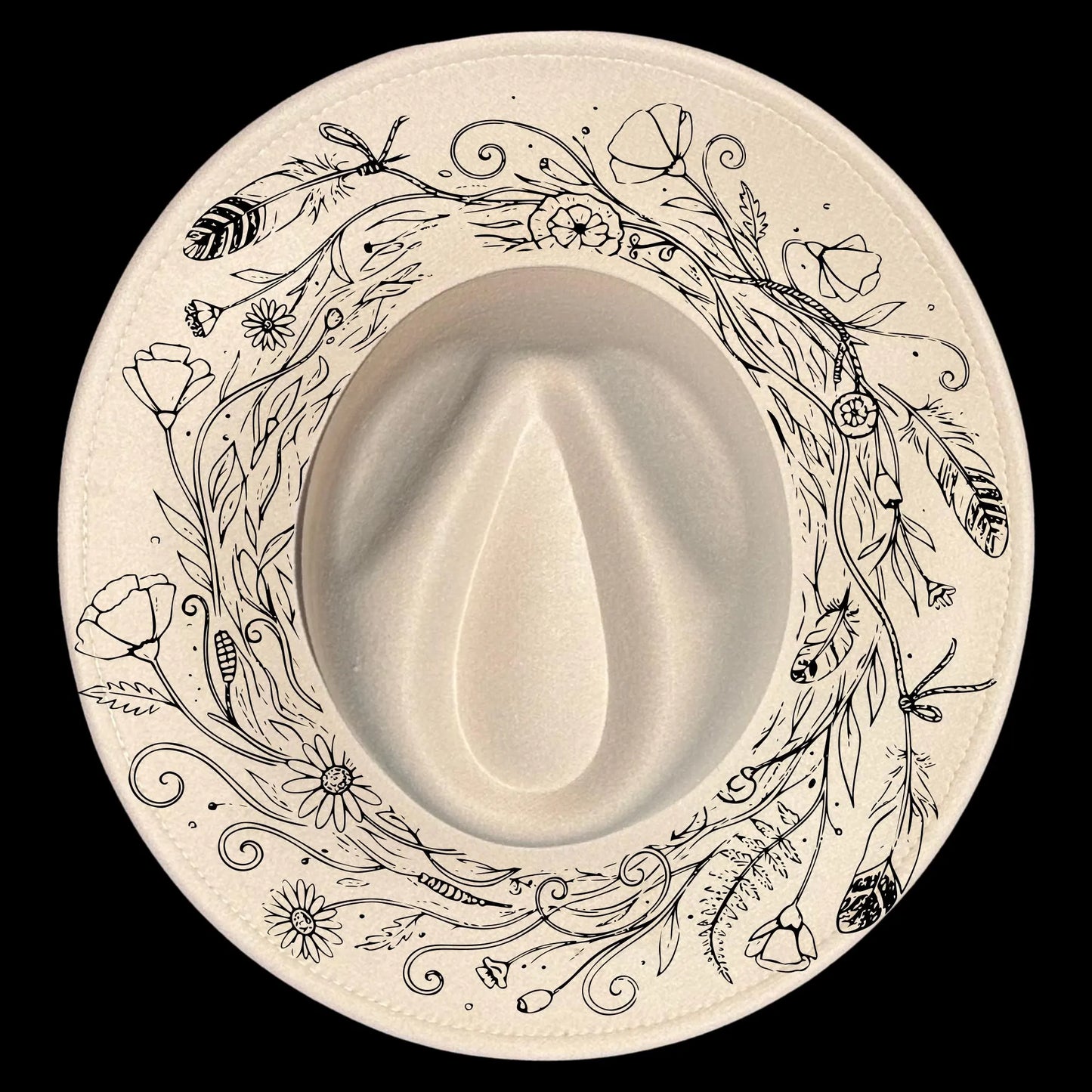 Wide brim hat with floral and leaf patterns on a black background