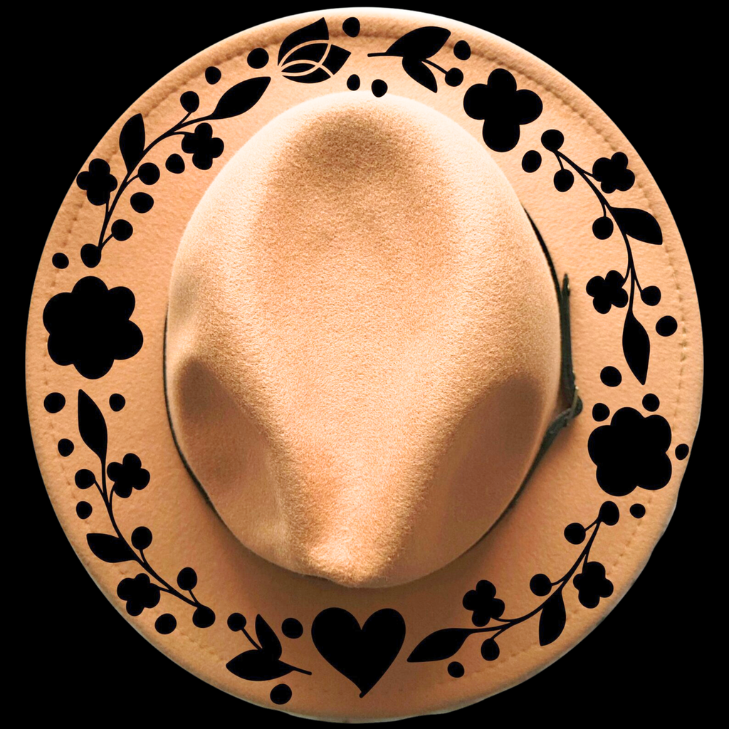 Beige hat with decorative black patterns on a black background