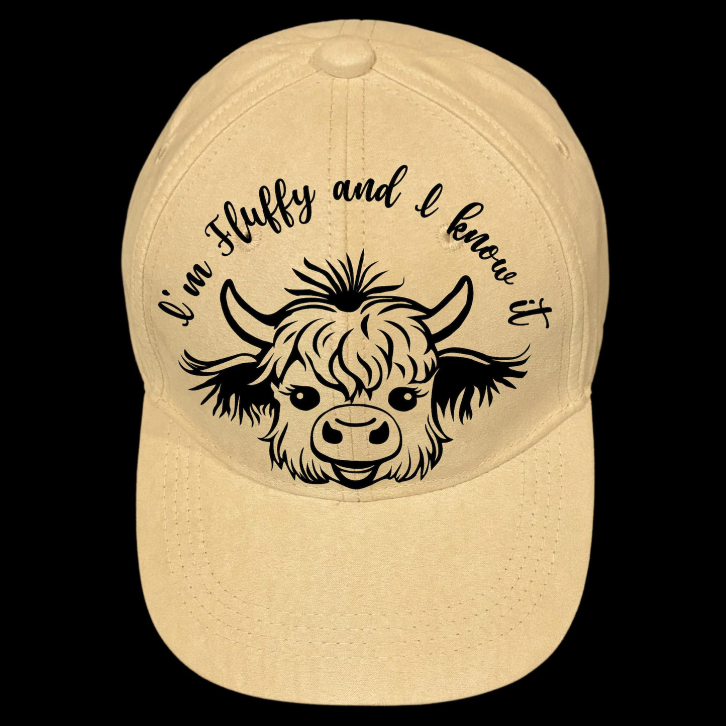 Baseball cap with a black highland cow illustration and text 'I'm Fluffy and I know it' on a black background