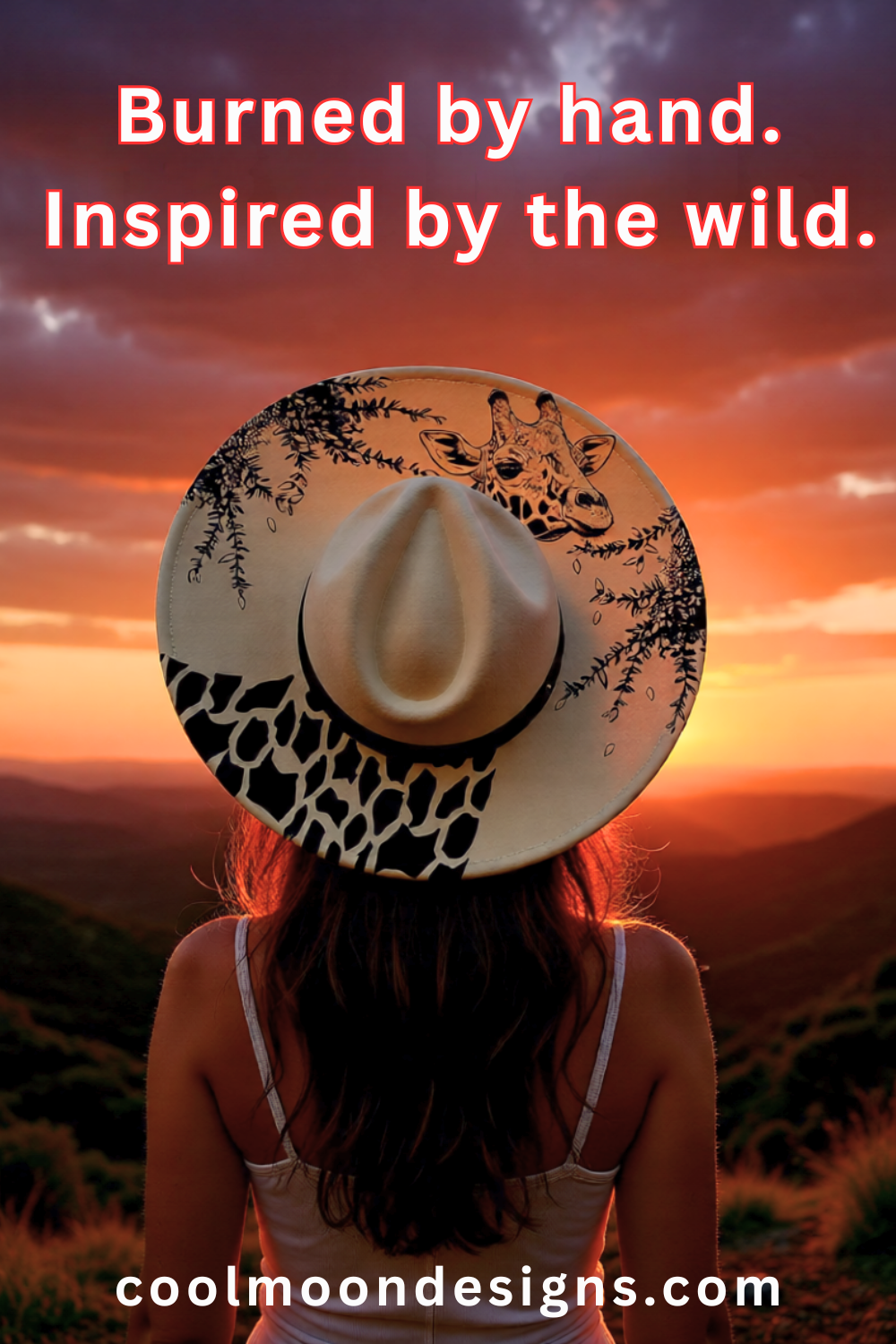 A woman wearing a wide-brimmed hat with animal prints against a sunset landscape, with text 'Burned by hand. Inspired by the wild.'