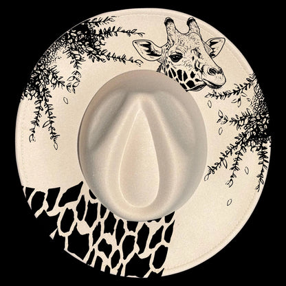 A giraffe hat burning design on a wide brim hat.