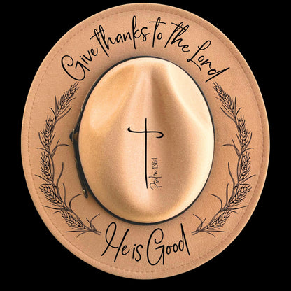 Narrow brim hat with 'Give thanks to the Lord He is Good' text and cross design on a black background