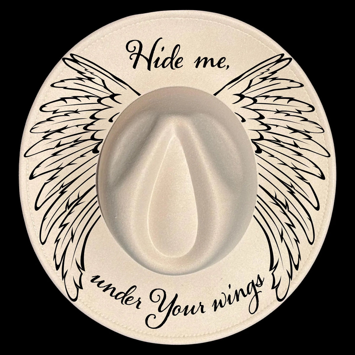 Wide brim hat burning design with wings, featuring the text 'Hide me under Your wings' on a black background.