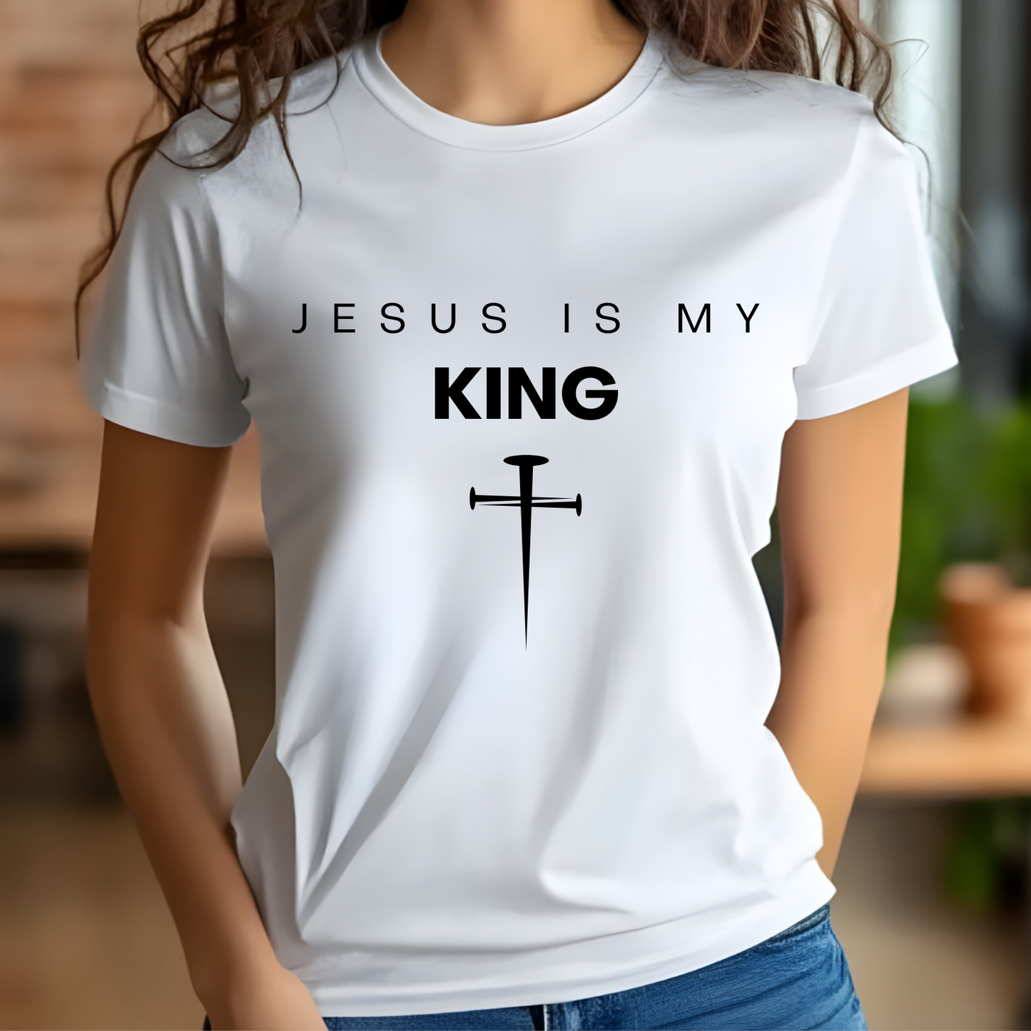 Jesus Is My King digital design on a woman’s white t-shirt.