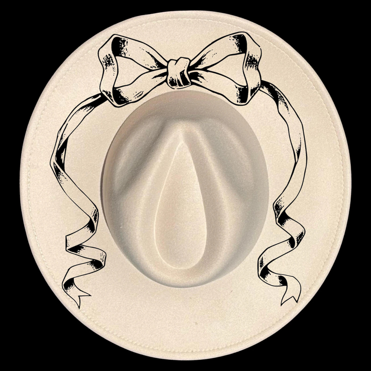 White cowboy hat with a decorative bow on a black background