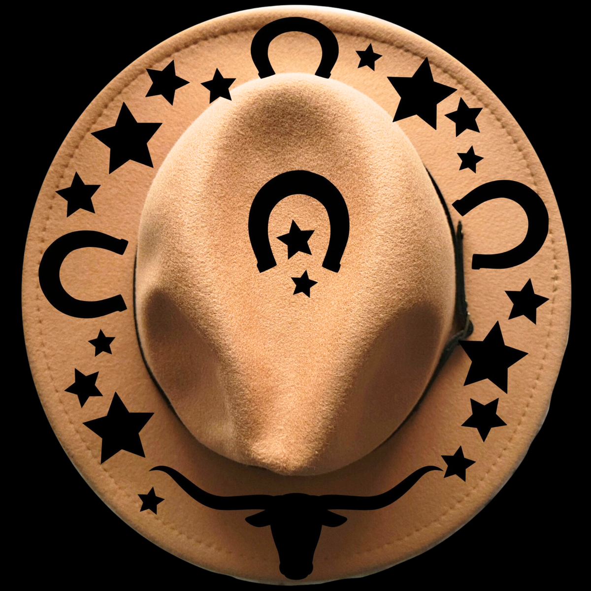 Beige cowboy hat with black star and horseshoe designs on a black background