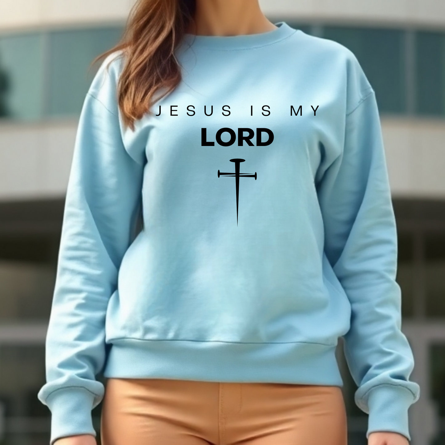 Jesus Is My Lord digital design on a woman’s blue sweatshirt.