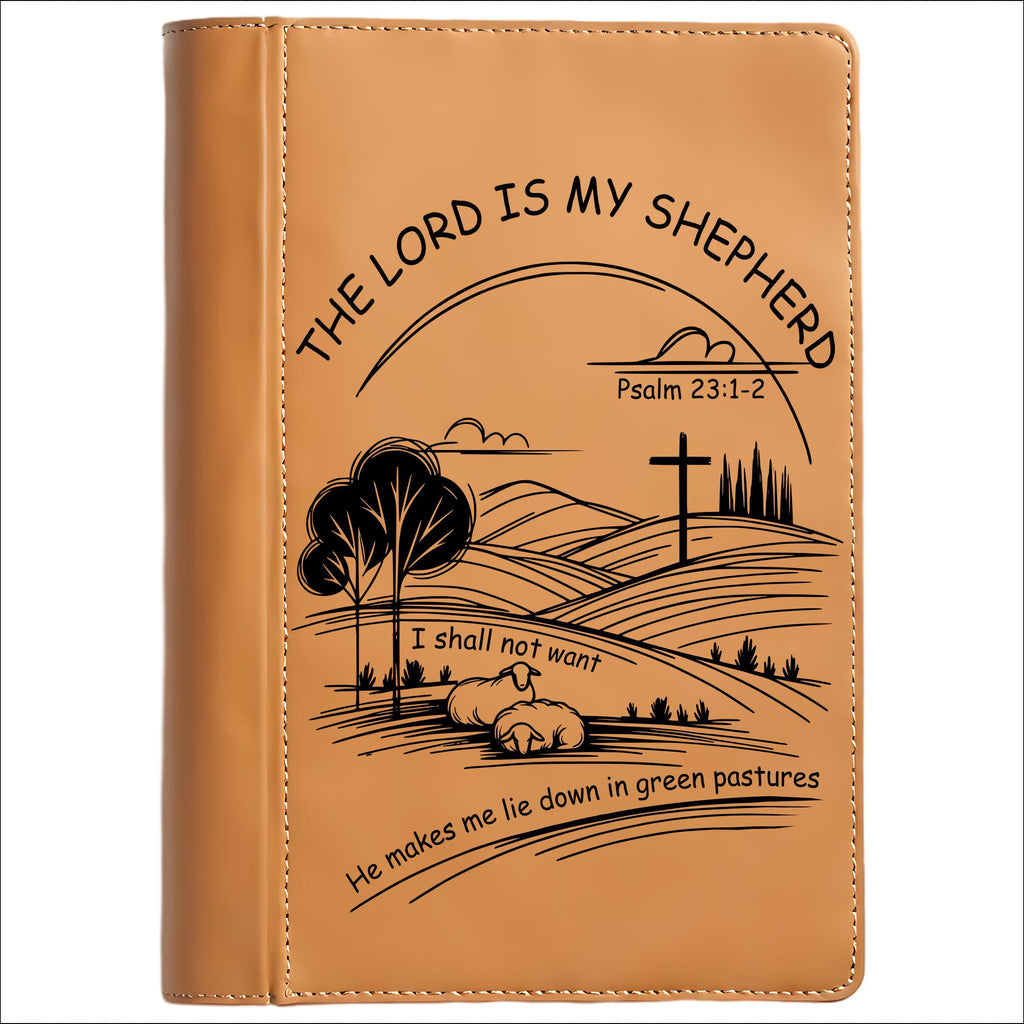 Brown leather journal cover with engraved landscape design and text "The Lord Is My Shepherd" on a white background