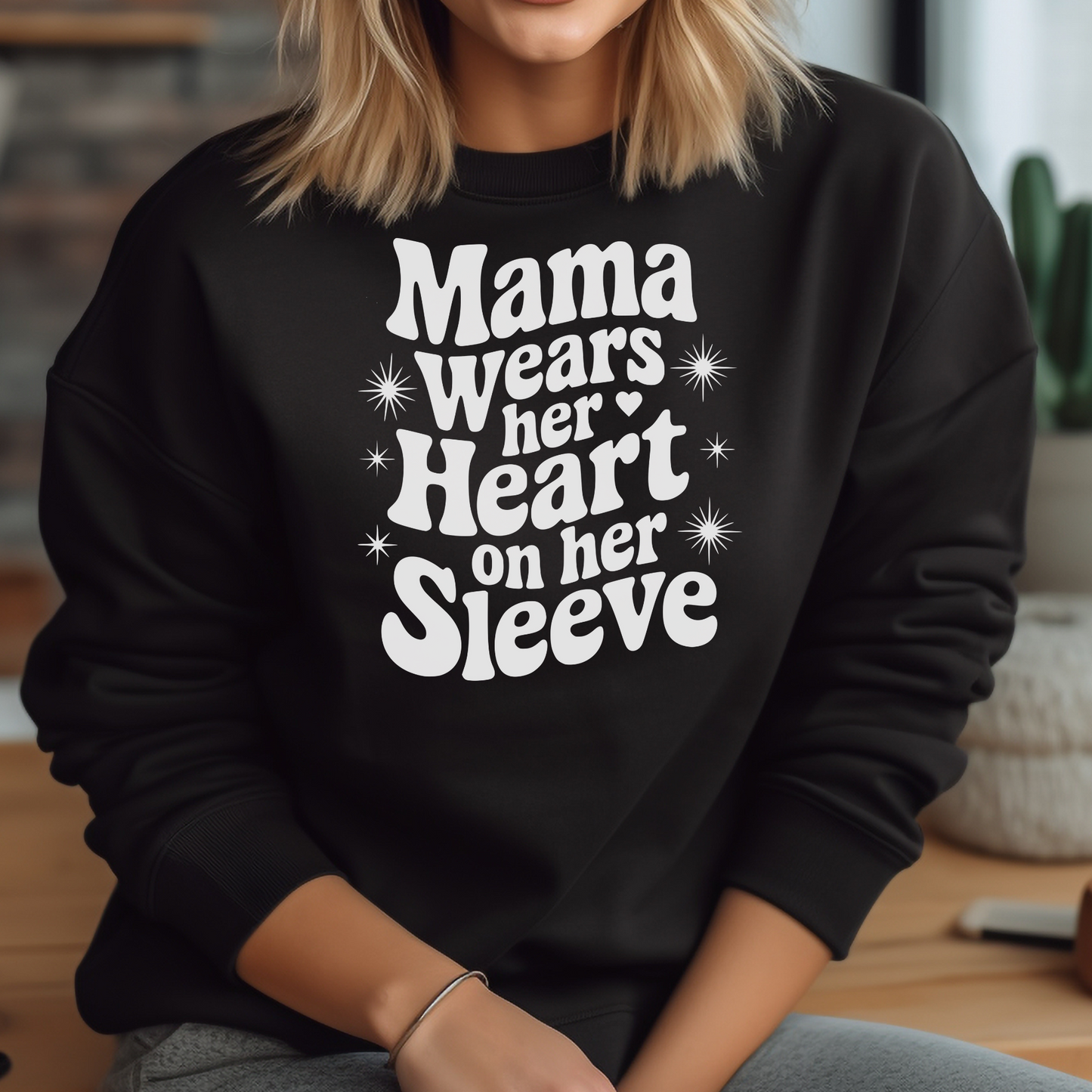 Mama Wears Her Heart On Her Sleeve digital design on a woman’s black sweatshirt