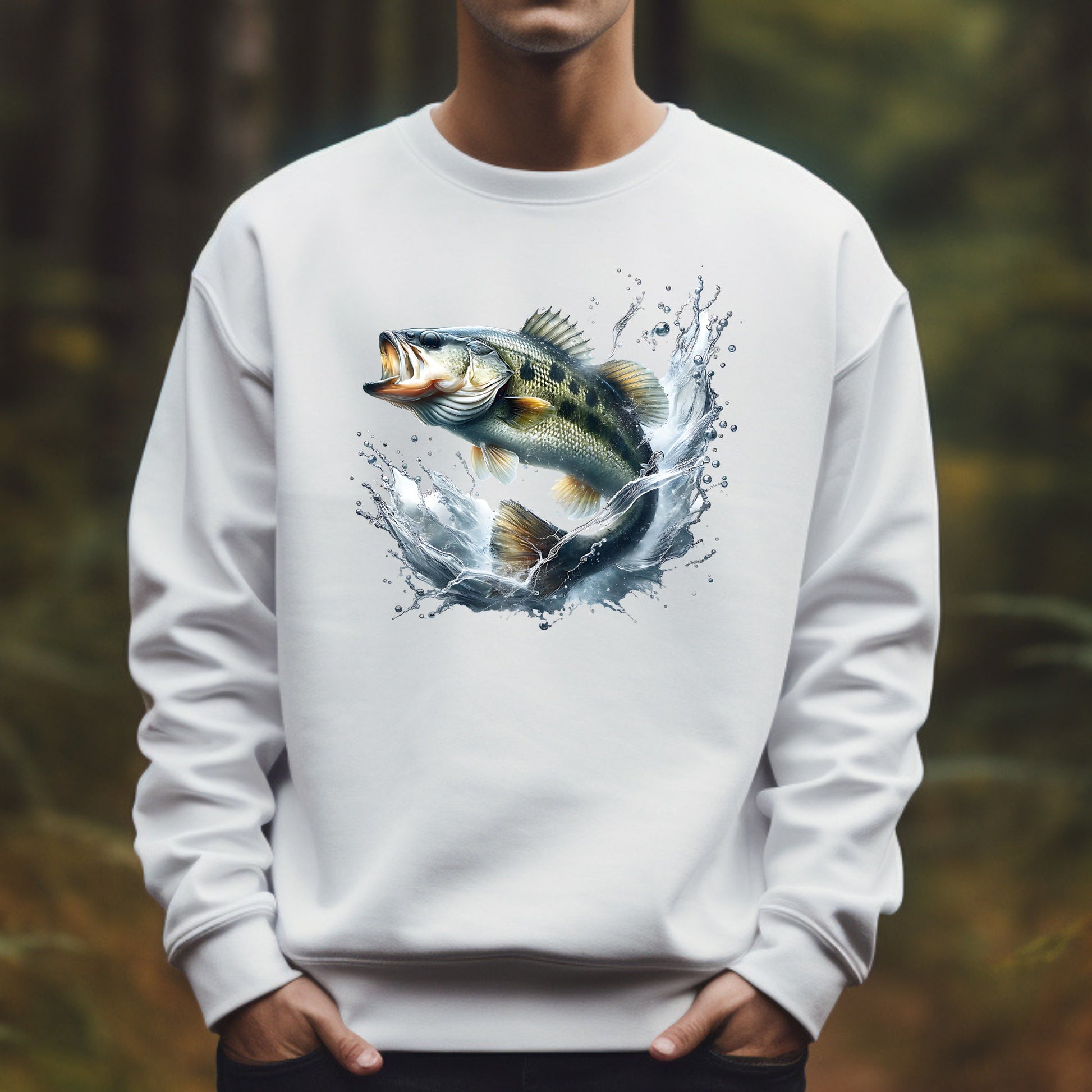White sweatshirt with a smallmouth bass fish leaping graphic worn by a man against a blurred natural background
