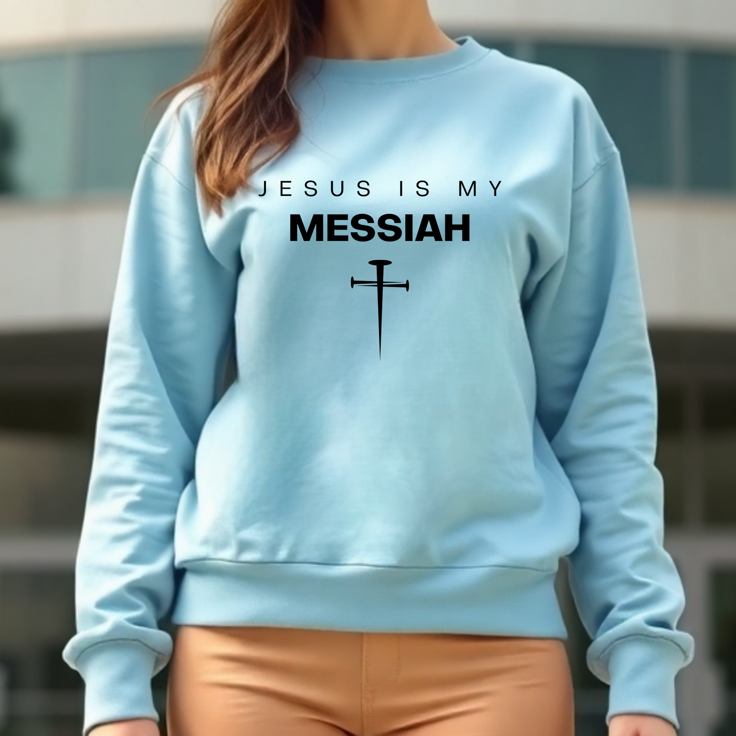 Jesus Is My Messiah digital design on a woman’s blue sweatshirt.