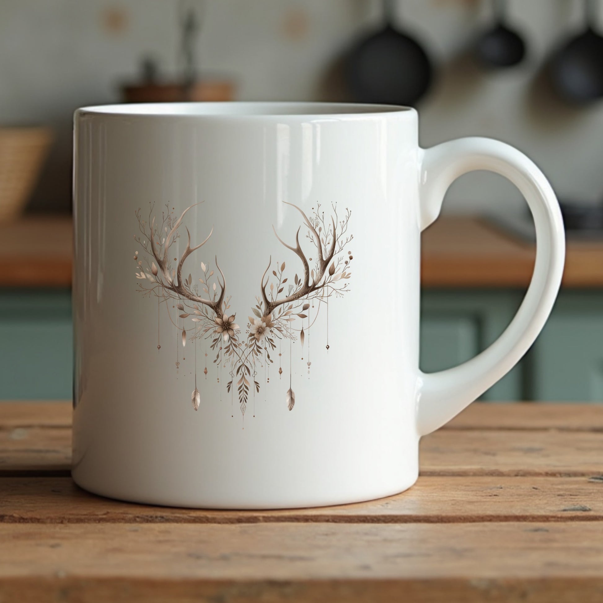 White mug with deer antler design on a wooden surface