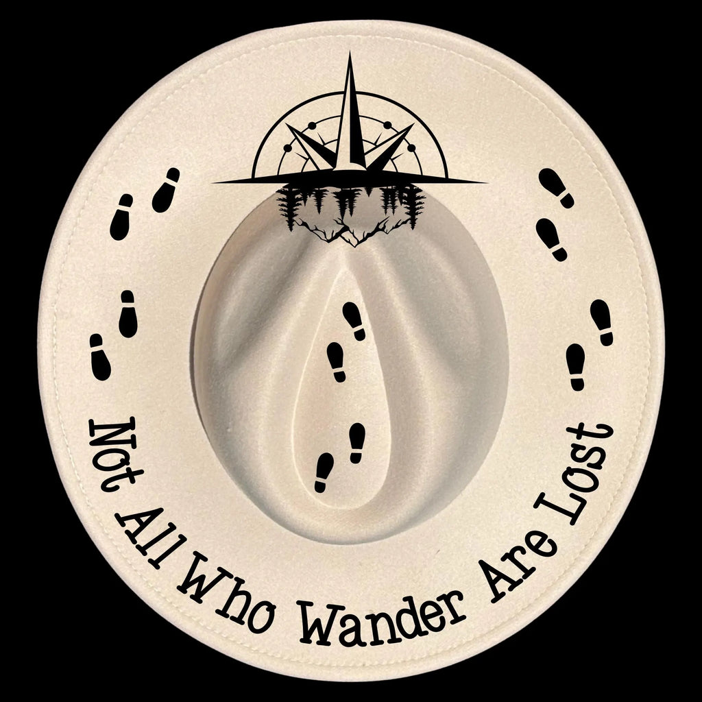 Wide brim hat with black compass design, footprints, and text 'Not All Who Wander Are Lost' on a black background.