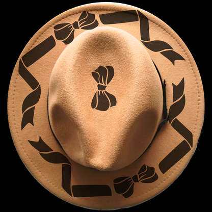 Narrow brim hat with black bow and ribbon designs on a black background