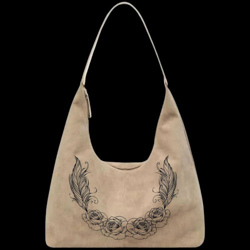 A leather purse with a roses and feathers pattern