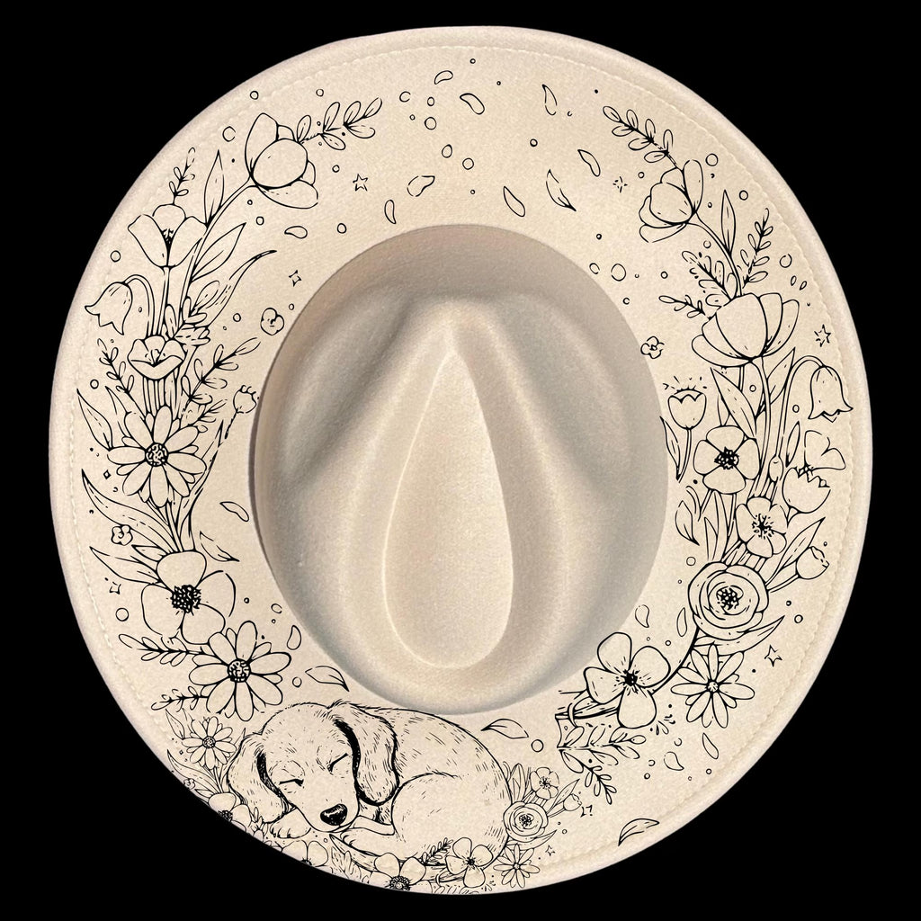 Wide brim hat with floral patterns and a sleeping dog illustration on a black background.