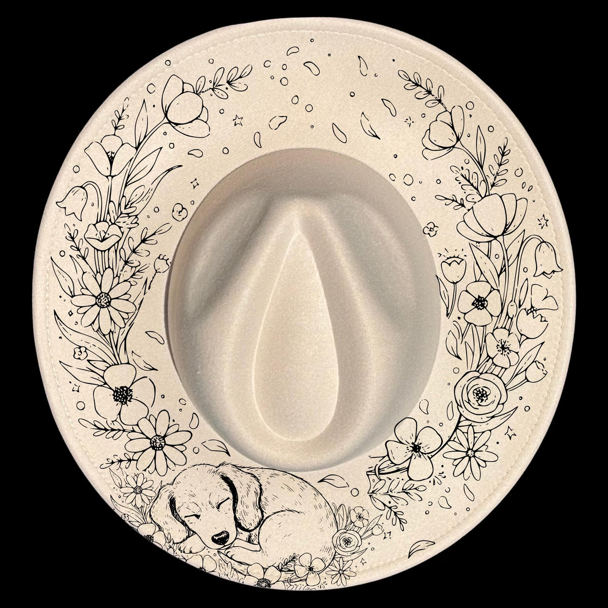 Wide brim hat with floral patterns and a sleeping dog illustration on a black background.