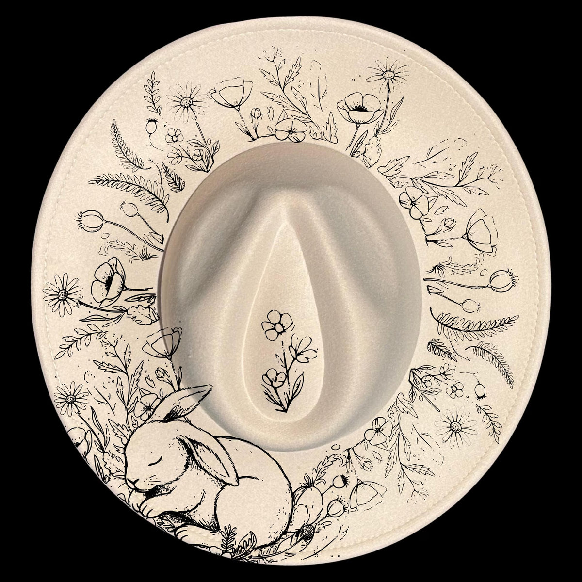 Wide brim hat with floral patterns and a sleeping rabbit on a black background
