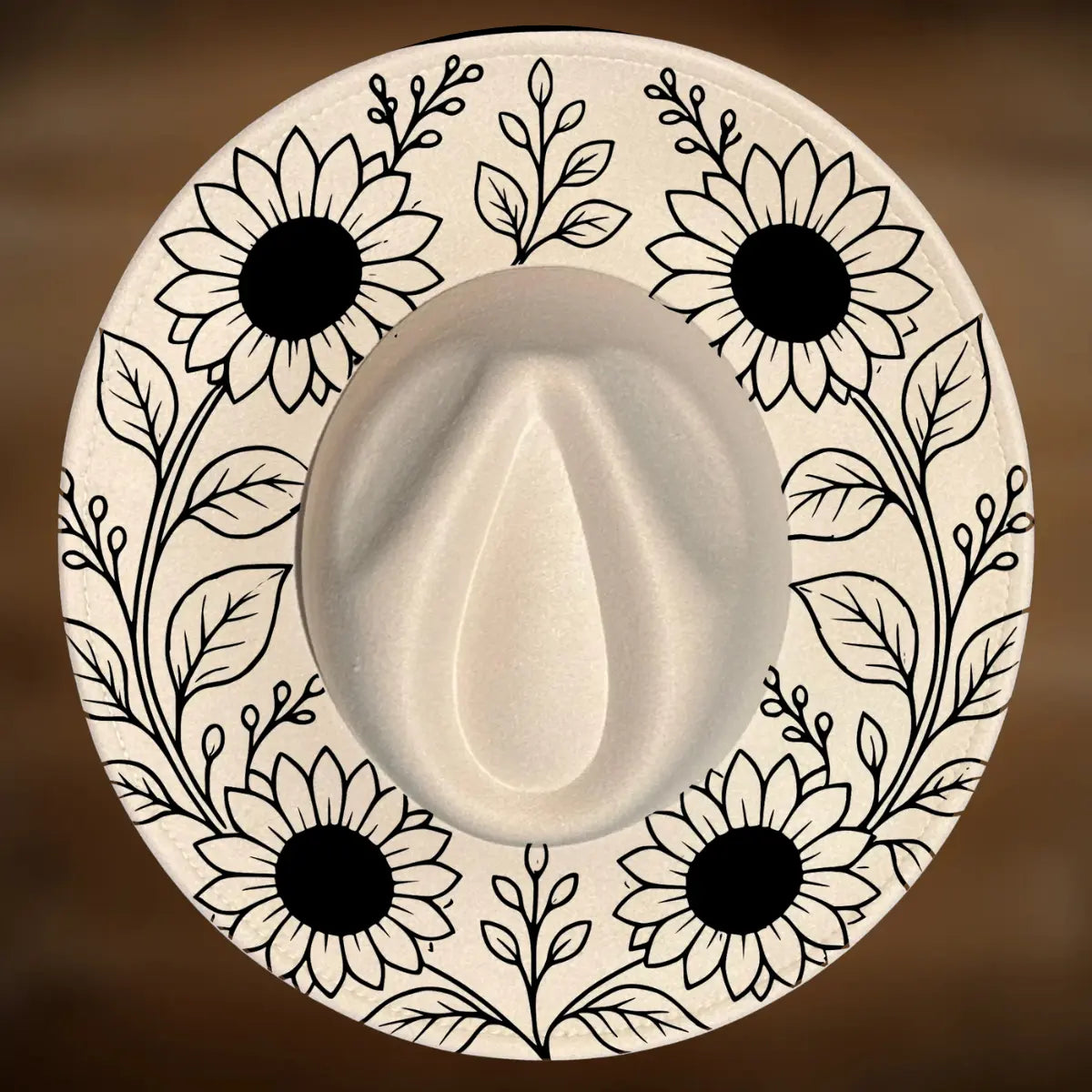 Wide brim hat burning design featuring sunflowers arranged around the brim.