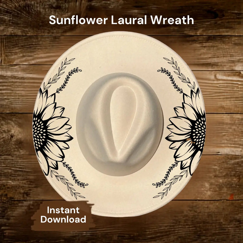 Wide brim hat with sunflower and laurel wreath design on a wooden surface