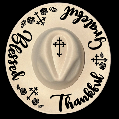 Wide brim hat with Thankful Grateful Blessed text and crosses on a black background