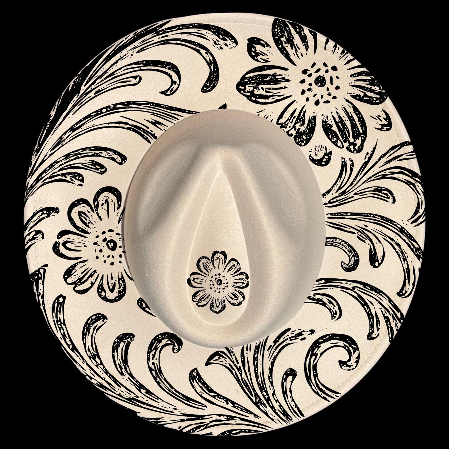 Wide brim hat with black floral and swirl patterns on a black background