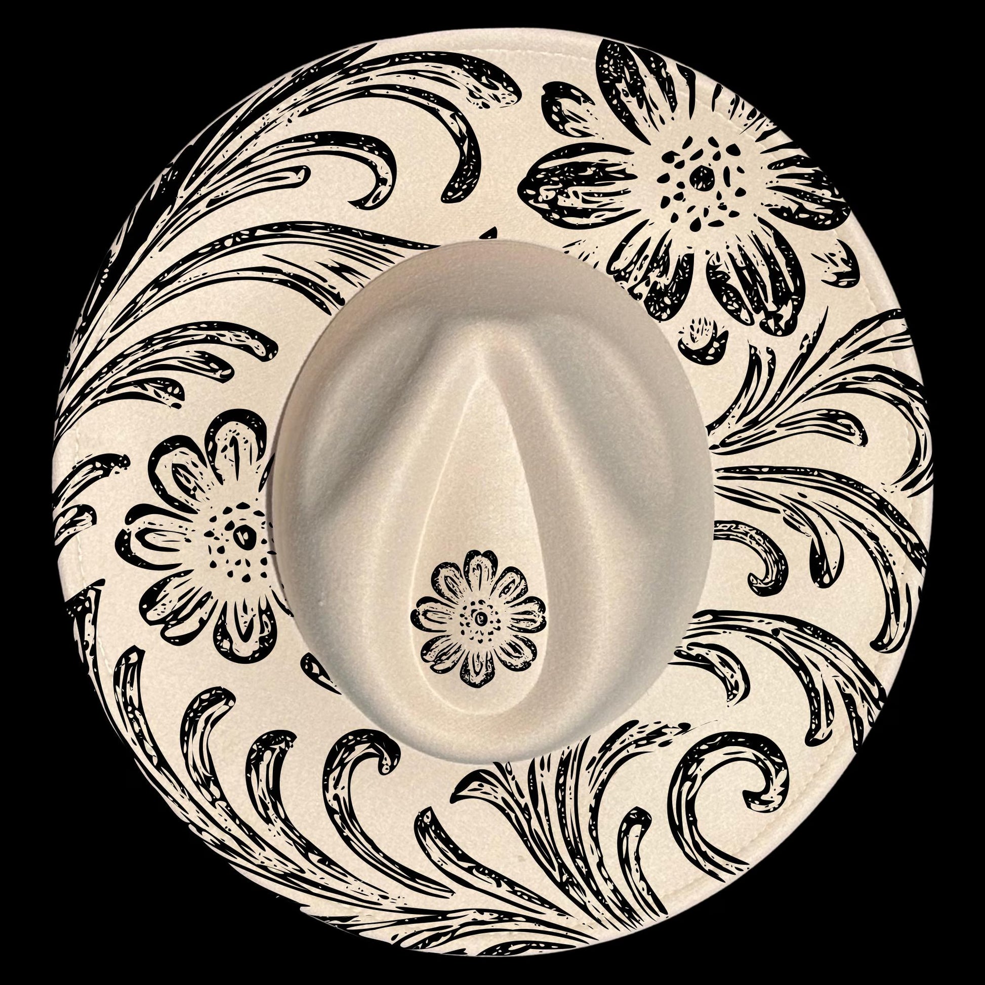 Wide brim hat with black floral and swirl patterns on a black background