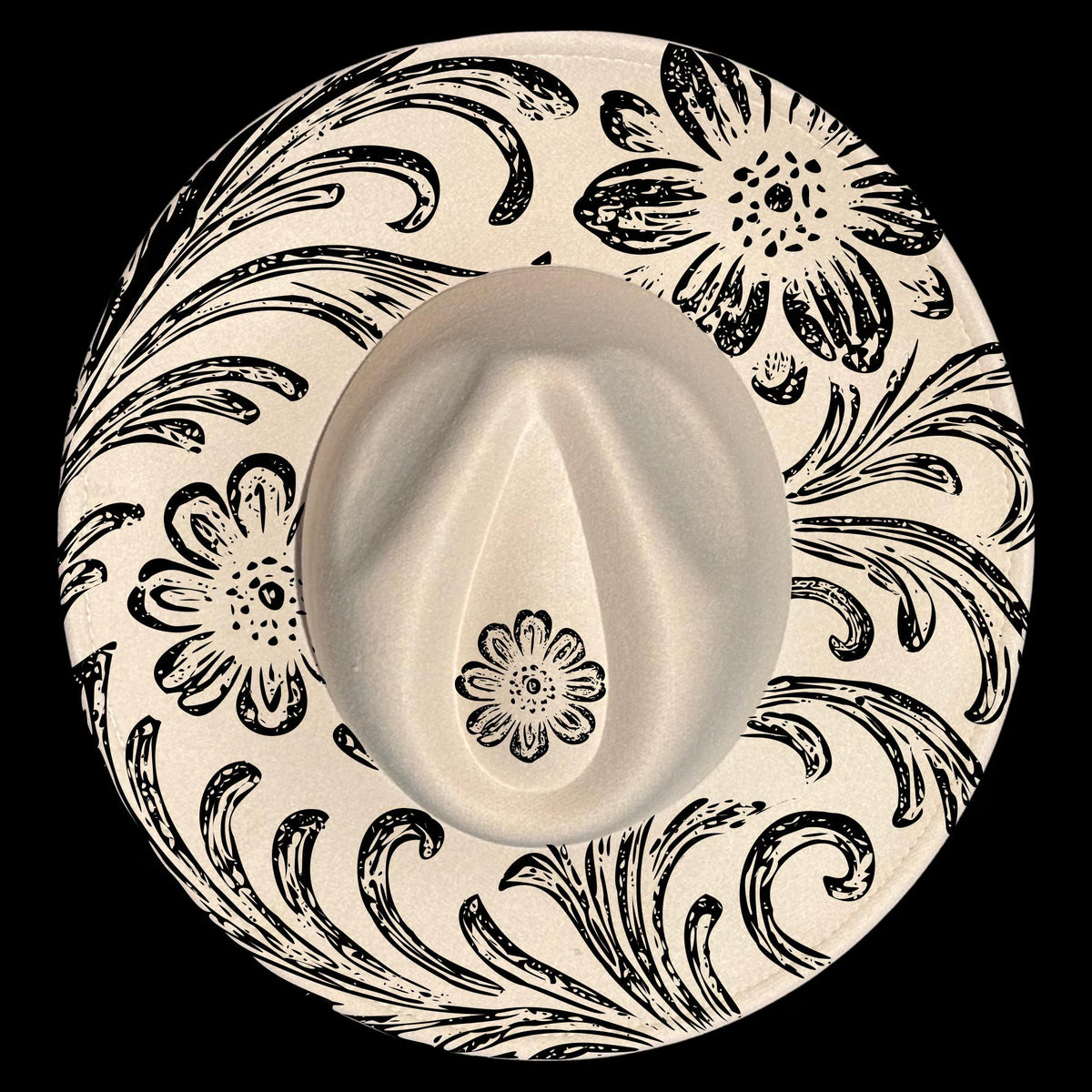 Wide brim hat with black floral and swirl patterns on a black background