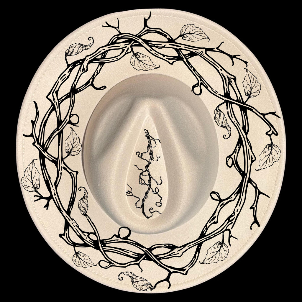 A vine wreath hat burning design on a wide brim hat