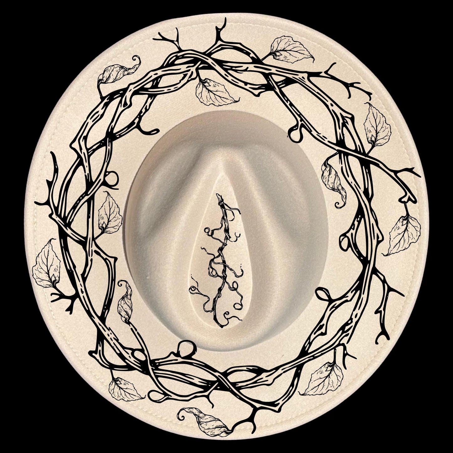 A vine wreath hat burning design on a wide brim hat