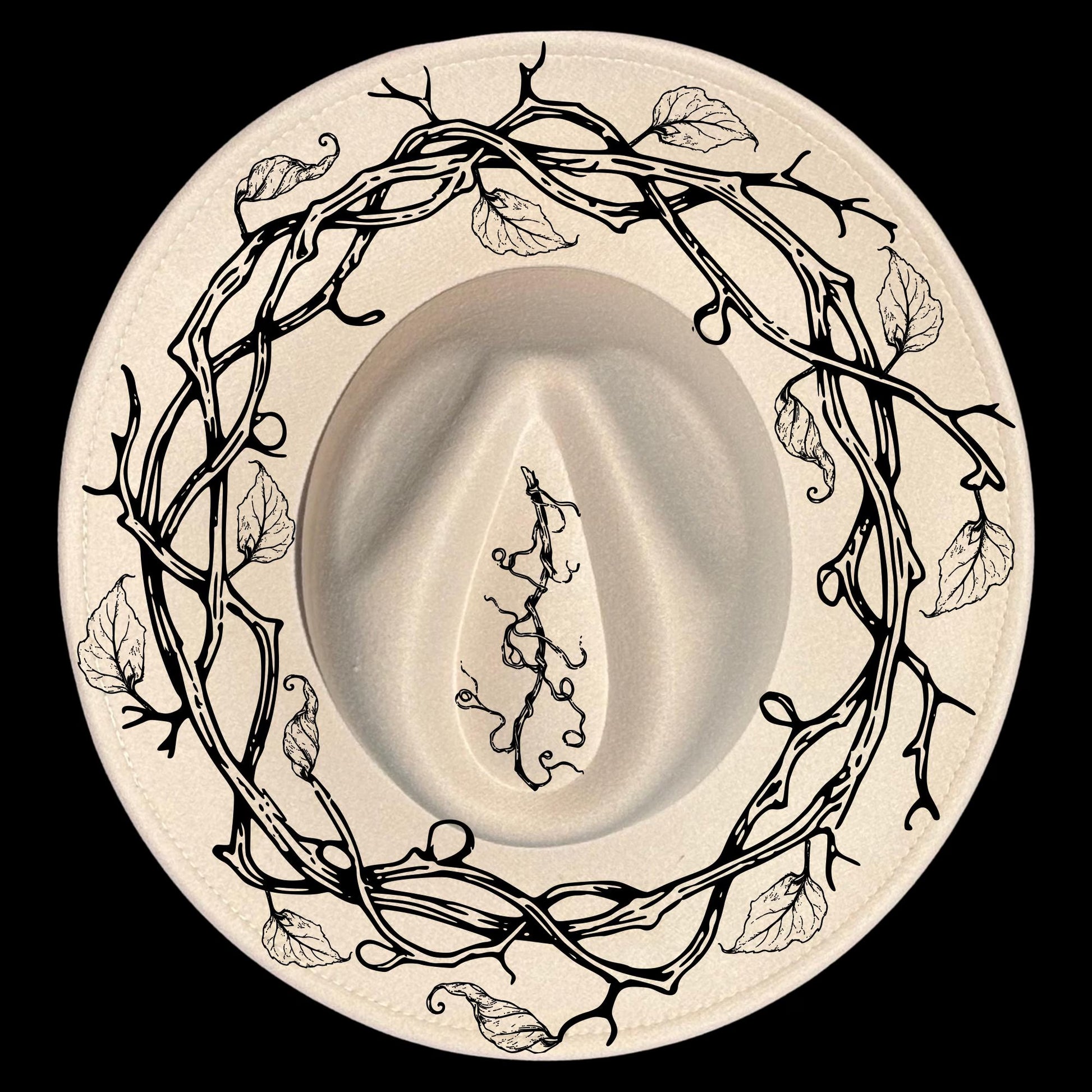 A vine wreath hat burning design on a wide brim hat