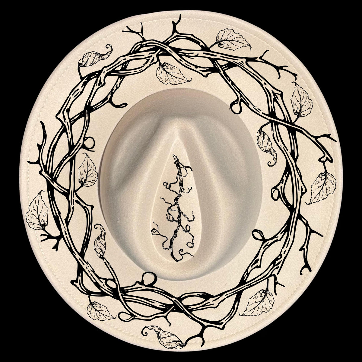 A vine wreath hat burning design on a wide brim hat
