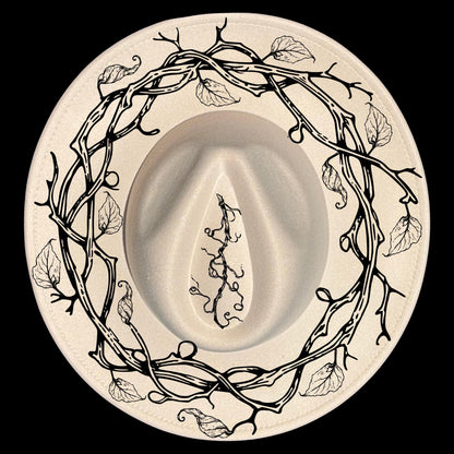 A vine wreath hat burning design on a wide brim hat