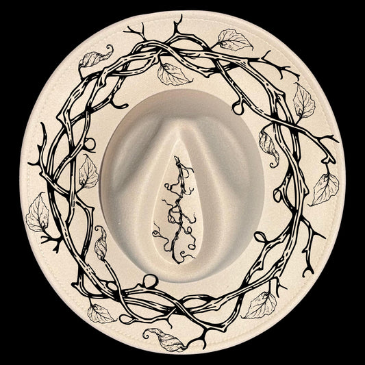 A vine wreath hat burning design on a wide brim hat