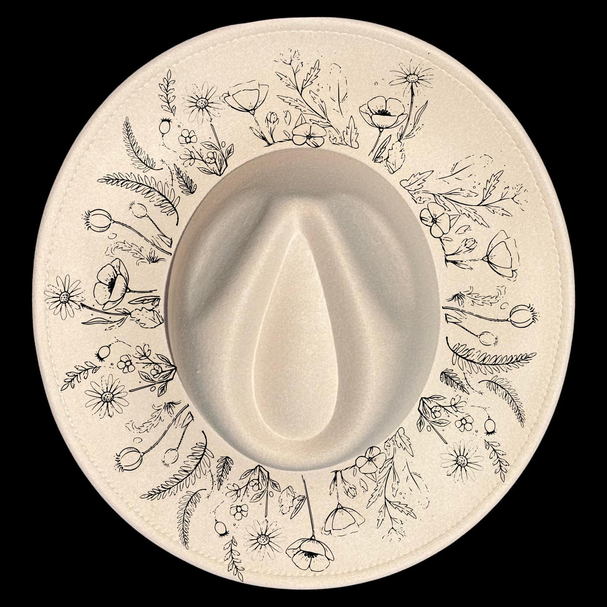 Floral patterns design burned on a wide brim hat on a black background