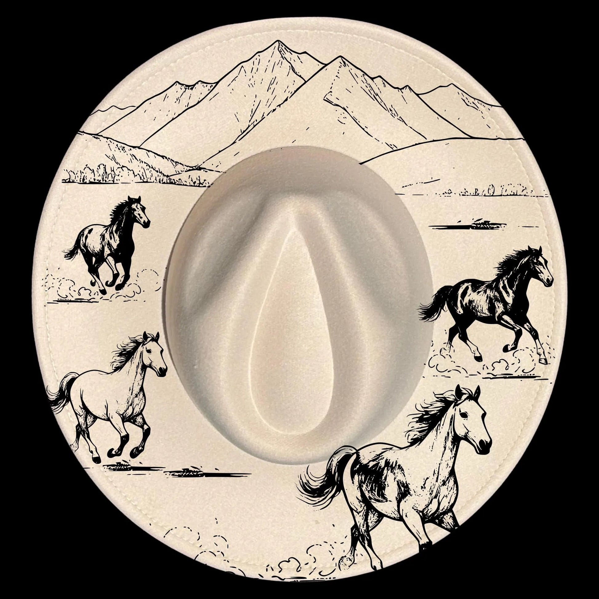 Wide brim cowboy hat with hat burning design of horses and mountains.