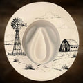 Decorative plate with a windmill and barn illustration on a brown background