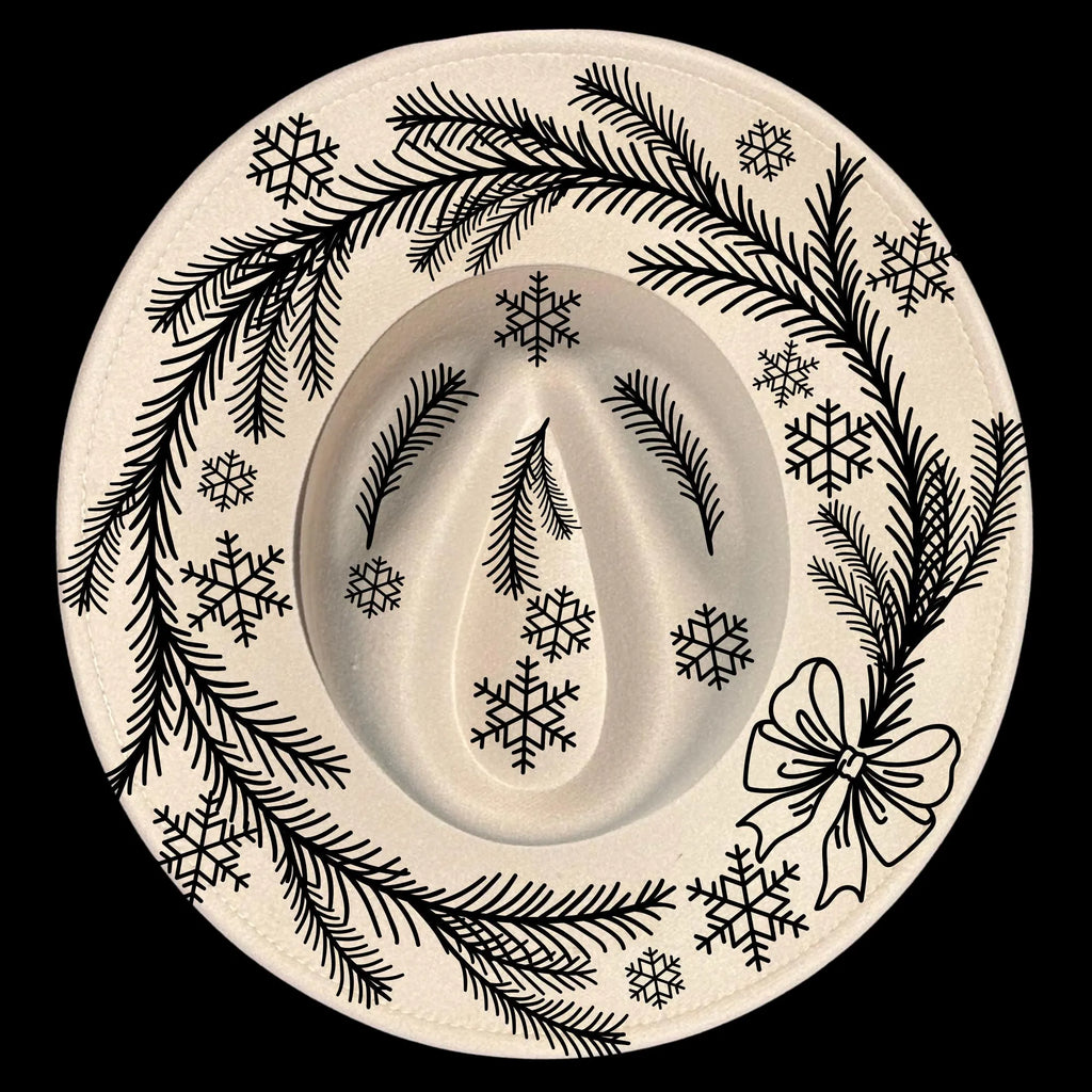 Decorative hat burning design with black winter-themed design on a wide brim hat